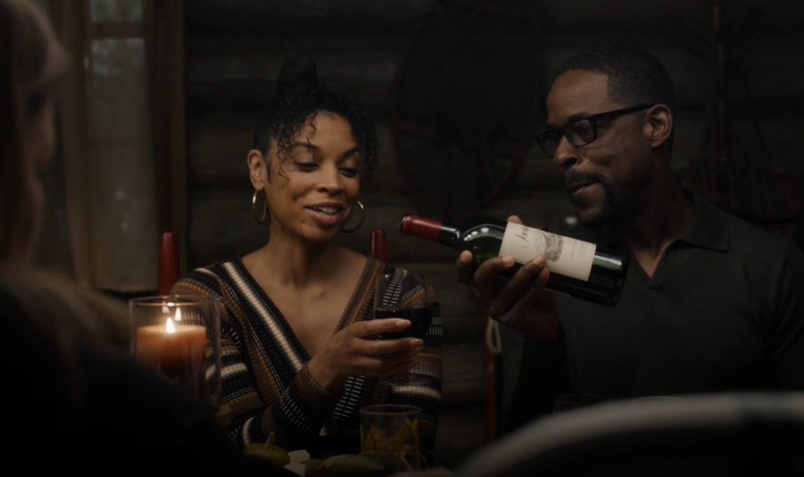 Screenshot from TV series This Is Us showing a man pouring a glass of Jordan Cabernet into a woman's glass