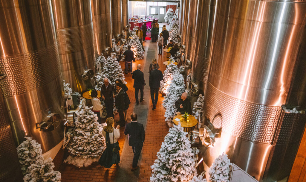 christmas trees lining pathway in fermentation room in winery