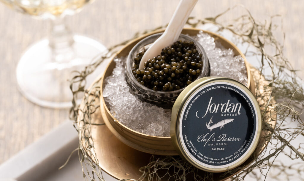 a close up image of jordan chef's reserve caviar in glass dish over bed of ice