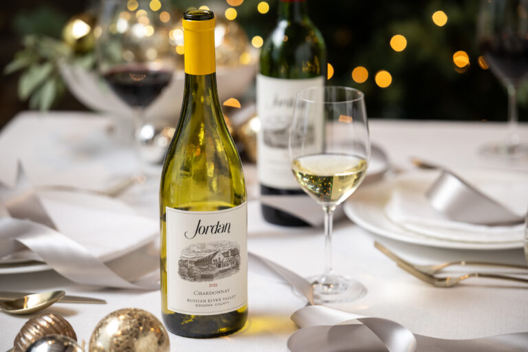 bottle of jordan chardonnay on table decorated for christmas meal