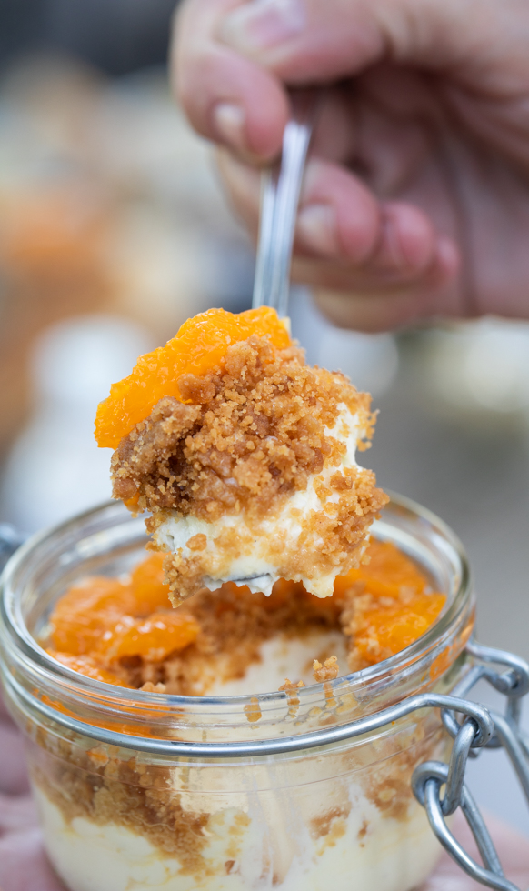 close-up image of fruit crumble dessert in glass jar