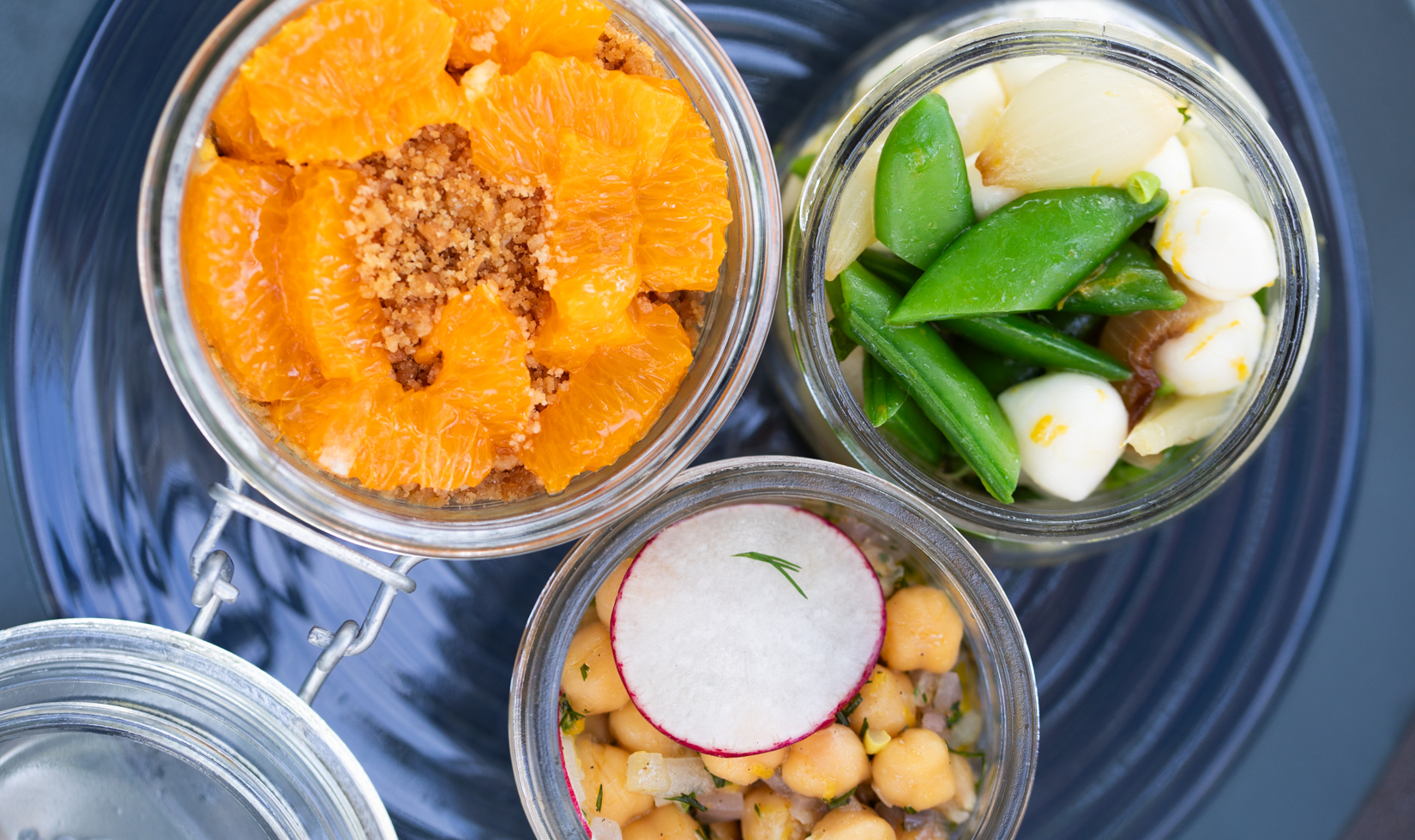 overhead image of picnic bites in glass jars