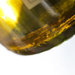 chardonnay bottle with tartrates at the bottom of bottle