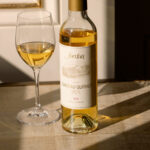 375mL bottle of dessert wine with afternoon shadows and golden color